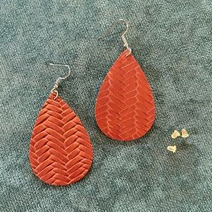 Beautiful leather look dangle earrings with three earring backs.
